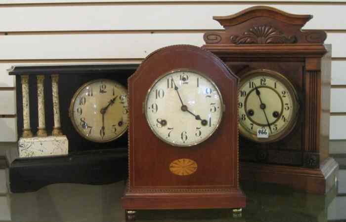 Appraisal: THREE ANTIQUE MANTEL CLOCKS American Waterbury with inlaid mahogany case