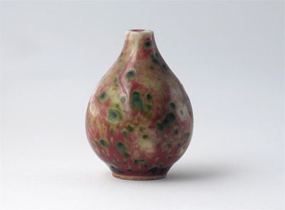 Appraisal: A small Chinese pear-shaped vase decorated with a green spotted