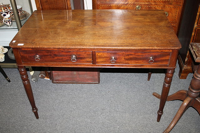 Appraisal: A TH CENTURY MAHOGANY WRITING TABLE with two short drawers