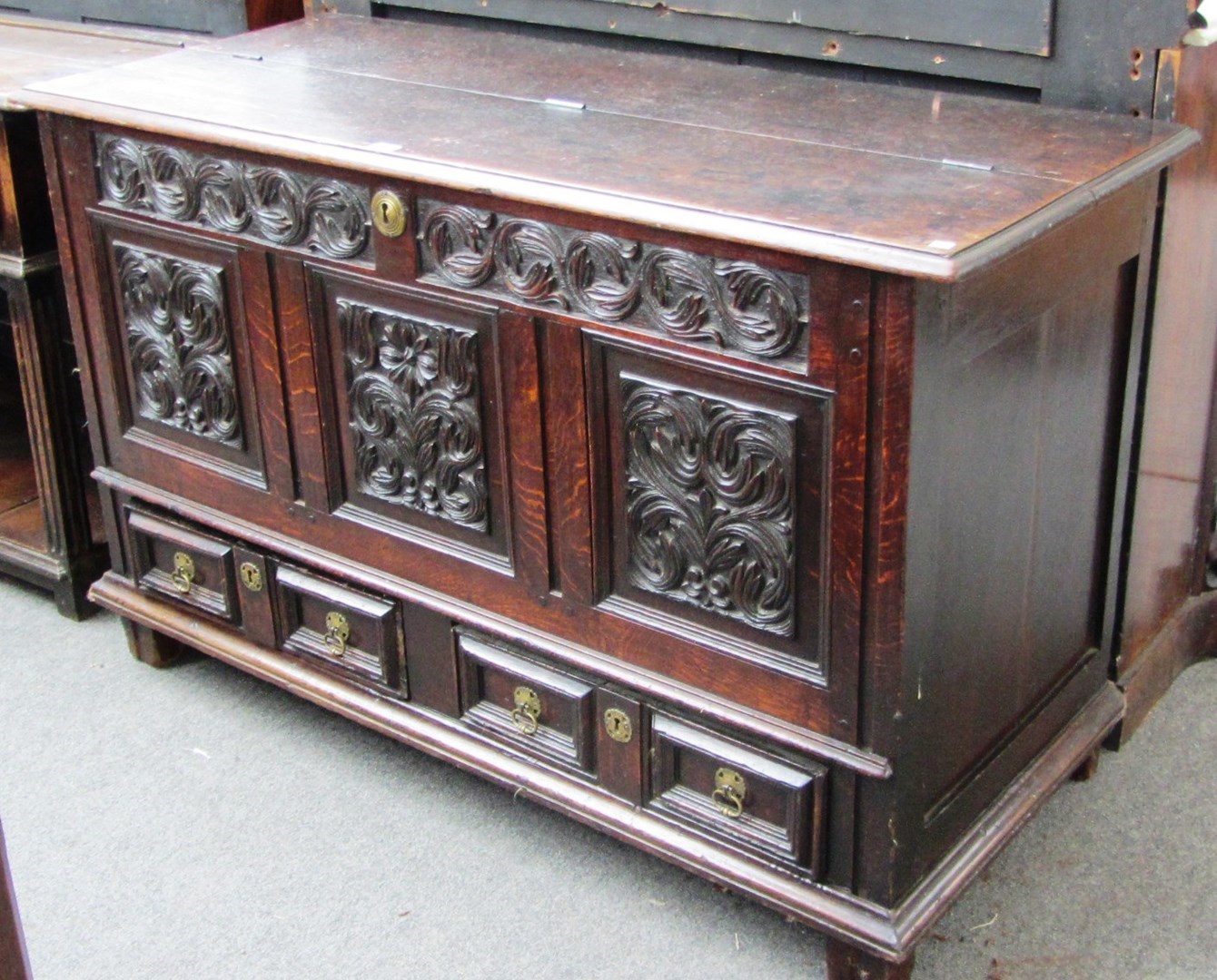 Appraisal: An th century oak mule chest with carved triple panel