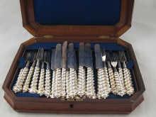 Appraisal: A set of eighteen silver plated dessert knives and forks