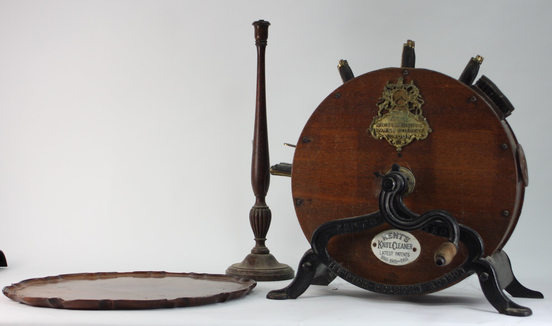 Appraisal: An oval tray with piecrust border an oak candlestick and