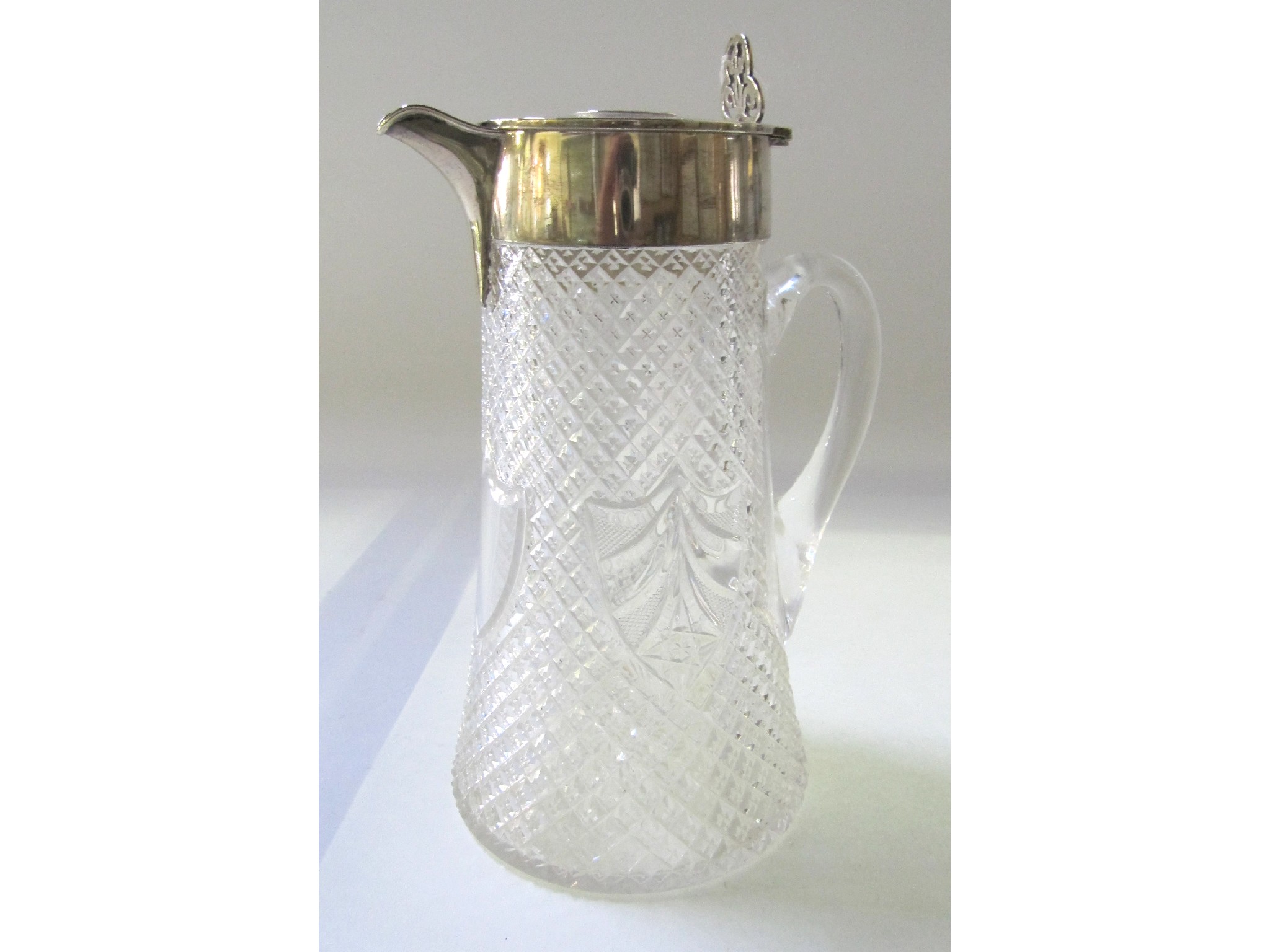 Appraisal: A silver topped cut glass claret jug glass def London