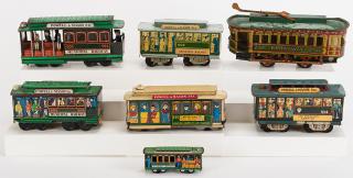 Appraisal: Lot of Seven Tin Trolley Toys Including five Powell Mason