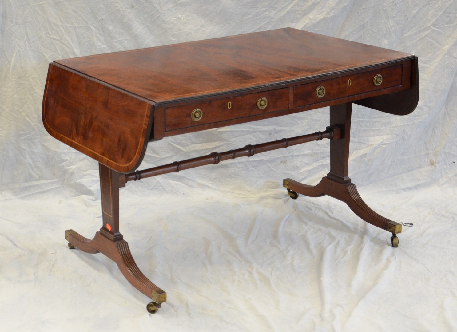 Appraisal: Mahogany Regency style drop leaf sofa table with drawers w