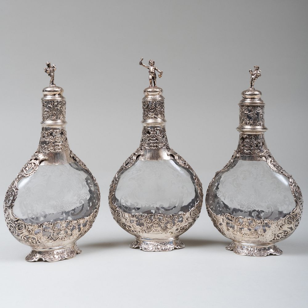 Appraisal: Set of Three Continental Silver Mounted Etched Glass Decanters Marked