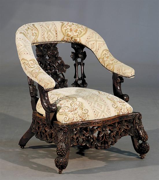 Appraisal: Anglo-Indian carved hardwood armchair late th centurycontinuous arm flanking padded