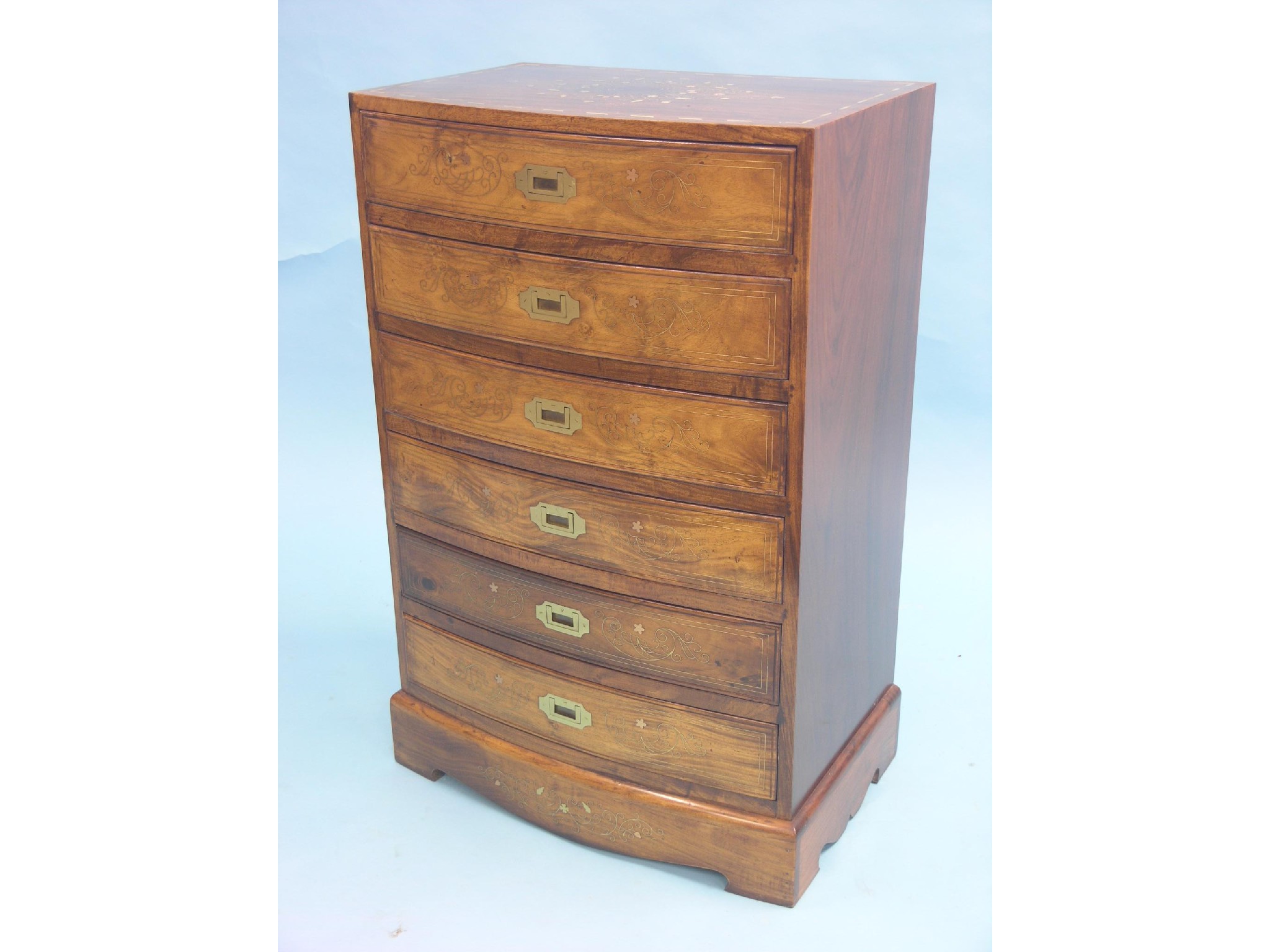 Appraisal: A colonial-style rosewood chest six bow-fronted drawers with brass flush-fitting