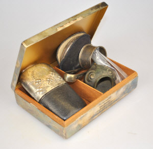 Appraisal: A silver powder compact napkin ring and cigarette holder in