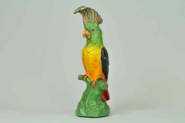 Appraisal: COCKATOO ON PERCH DOORSTOP Very colorful full figured cast iron