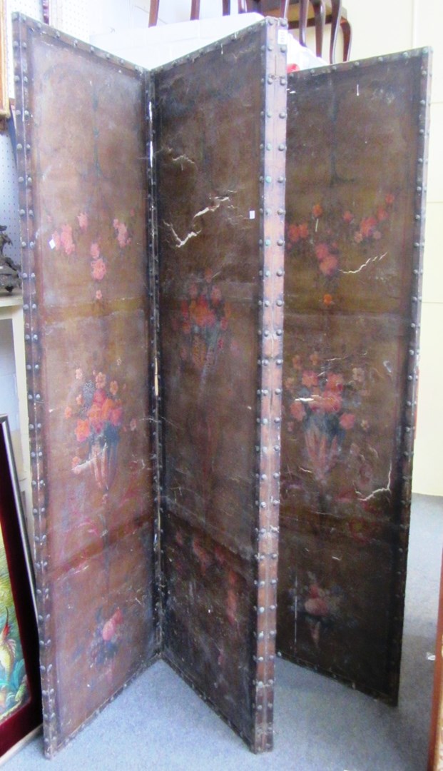 Appraisal: A th century continental studded leather four fold draft screen