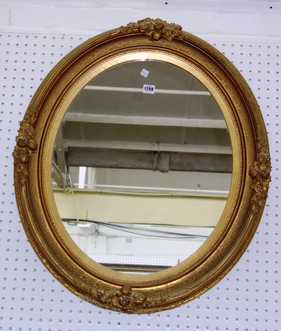 Appraisal: An early th century gilt framed oval wall mirror with