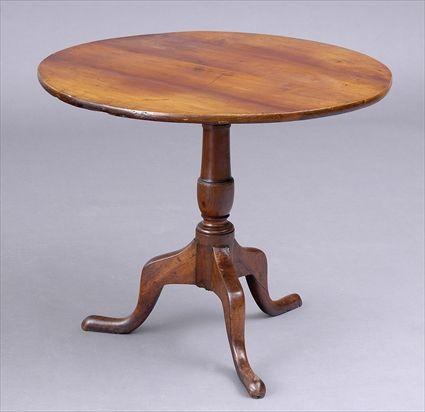 Appraisal: CHIPPENDALE CHERRY TILT-TOP TRIPOD TABLE The plain top on a