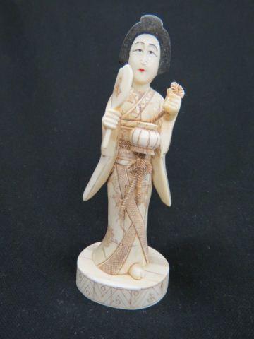 Appraisal: Japanese Carved Bone Figurine of a Geisha holding a mirror