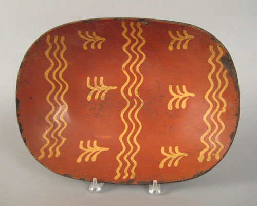 Appraisal: Pennsylvania redware loaf dish th c with yellow slip decoration