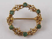 Appraisal: A carat gold emerald brooch approx cm gms