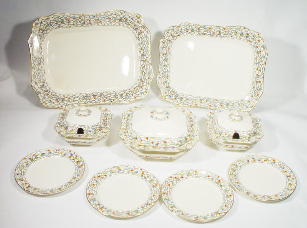 Appraisal: s Fieldings pottery part dinner service hand coloured and transfer