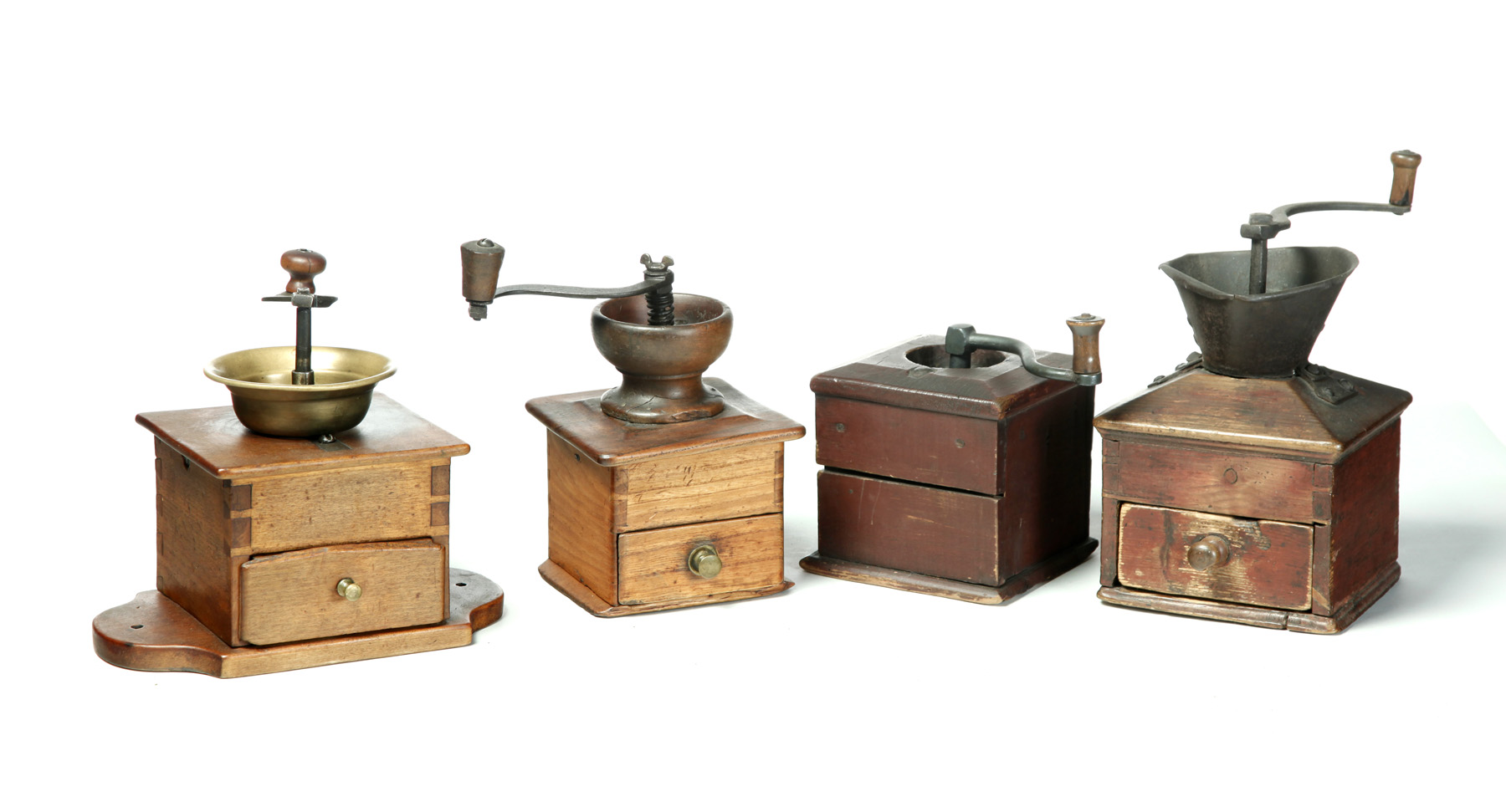 Appraisal: FOUR AMERICAN COFFEE GRINDERS Nineteenth century pine Three dovetailed with