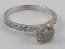 Appraisal: A white metal tests carat gold diamond solitaire ring with