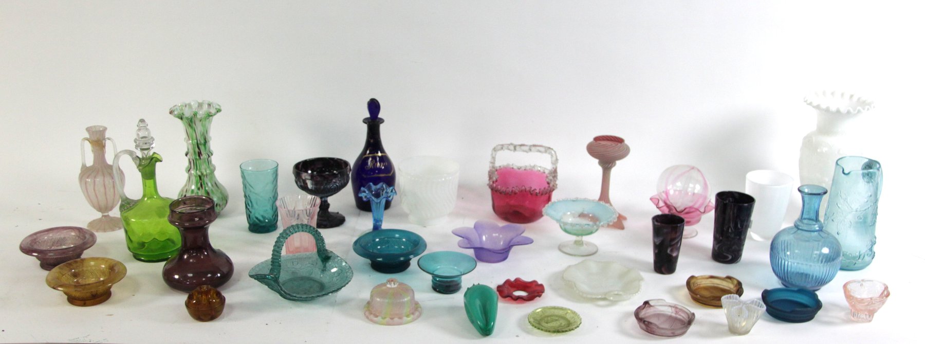 Appraisal: A collection of coloured glass ware including a Cranberry basket