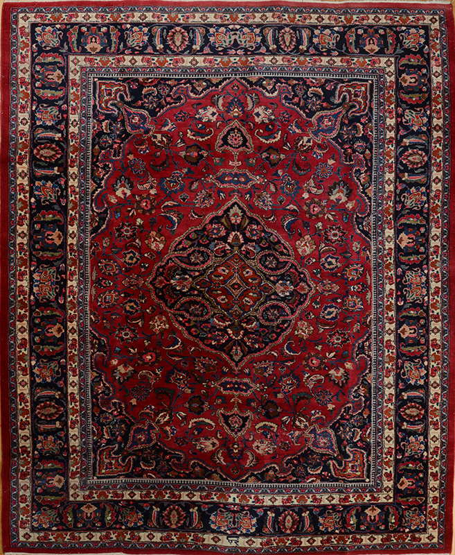 Appraisal: PERSIAN WINE RED GROUND MEDALLION CARPET The cobalt medallion anchored