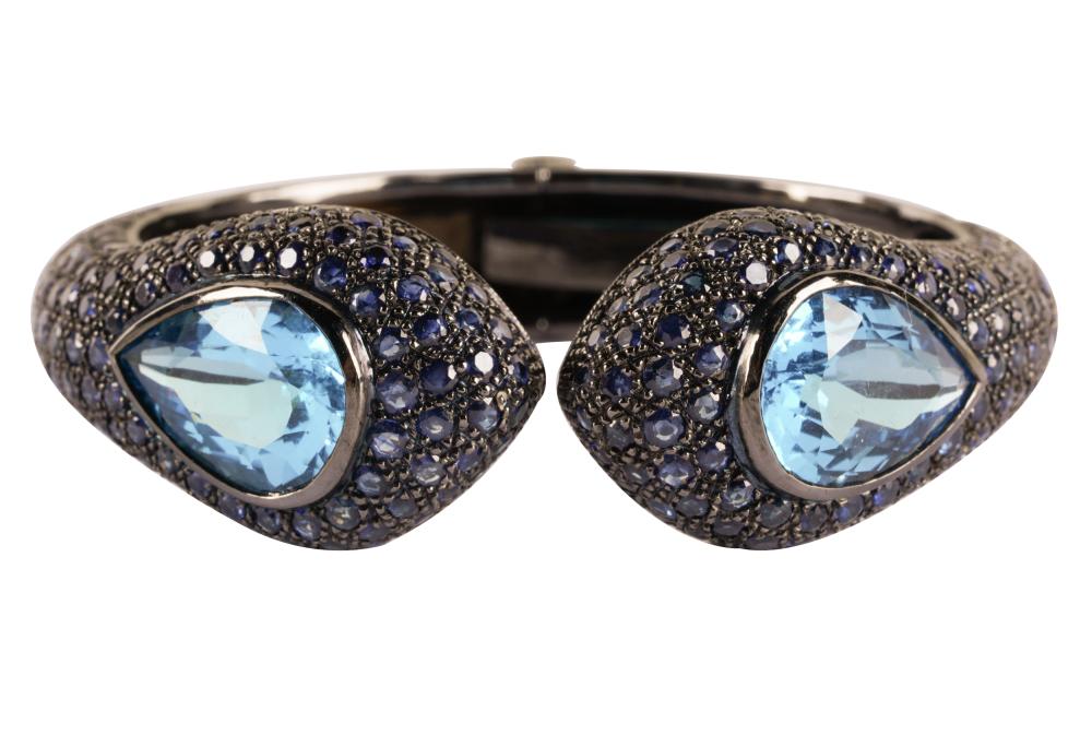 Appraisal: STERLING SILVER SAPPHIRE BLUE TOPAZ CUFF BRACELETcontaining two pear irradiated