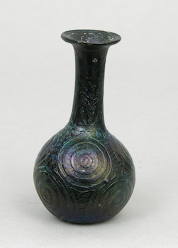 Appraisal: A Black Iridescent Glass Vase Mediterranean Black glass with impressed