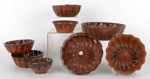 Appraisal: Eight redware food molds th c largest - dia