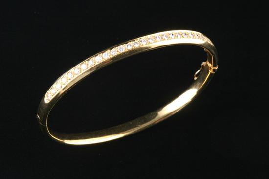 Appraisal: K YELLOW GOLD AND DIAMOND BANGLE BRACELET Twenty-seven diamonds combined