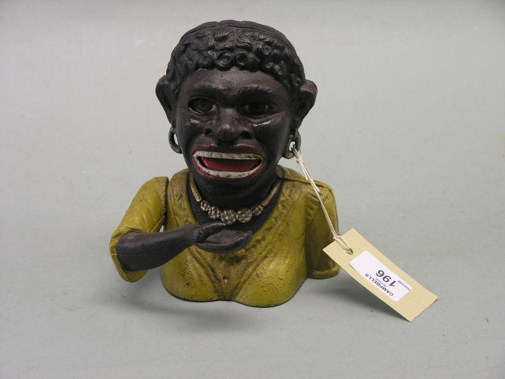 Appraisal: A cast iron money bank 'Dinah' negro female with painted