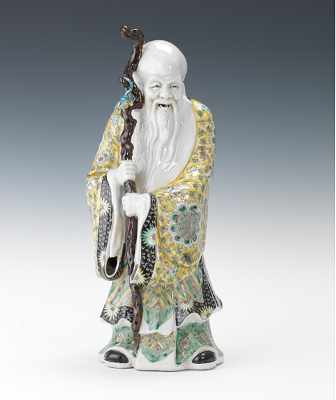 Appraisal: A Porcelain Figure of an Immortal with Peach on Staff