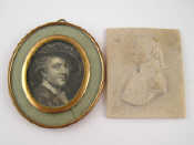 Appraisal: A miniature print portrait in a yellow metal double oval