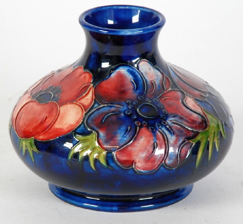 Appraisal: MOORCROFT ANEMONE PATTERN TUBE LINED ONION SHAPED VASE painted in