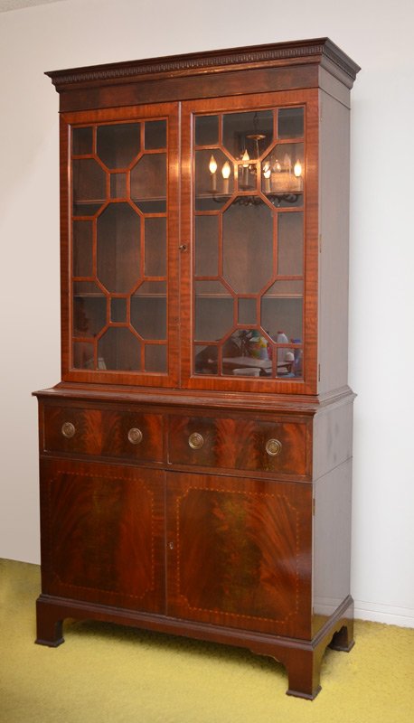 Appraisal: INLAID MAHOGANY BREAKFRONT CHINA CABINET Carved molding over glass doors