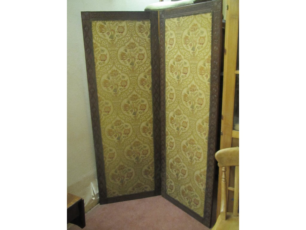 Appraisal: Pair of oak framed and tapestry decorated folding dressing screens