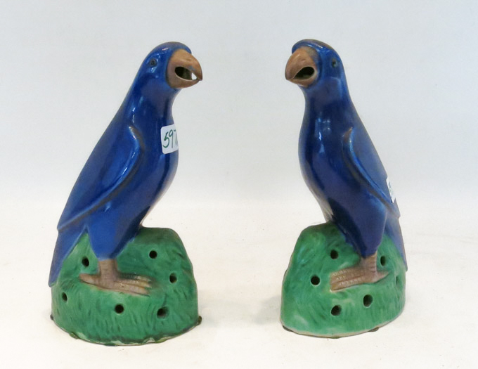 Appraisal: PAIR CHINESE POTTERY PARROT FIGURINES in opposing positions blue glaze