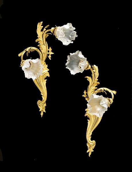 Appraisal: A pair of Louis XV style gilt bronze two light