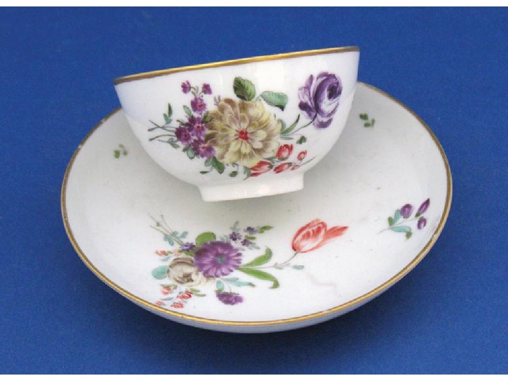 Appraisal: A COZZI TEA BOWL AND SAUCER circa the cream ground