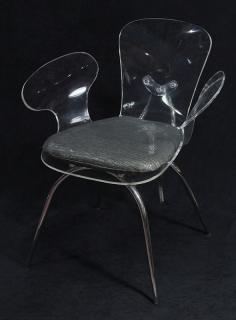 Appraisal: Moderne acrylic chair Moderne acrylic chair having outswept arms with