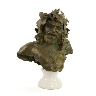 Appraisal: A CONTINENTAL BRONZE BUST th century Depicting Bacchus having an