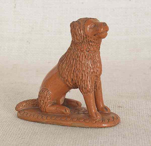 Appraisal: Pennsylvania redware figure of a seated dog th c h