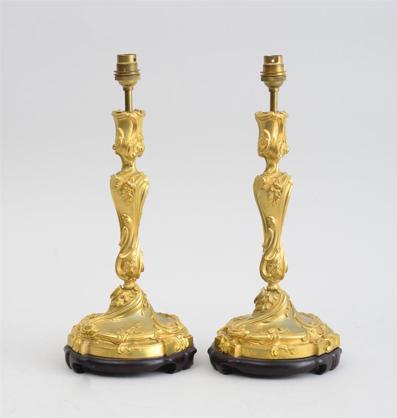 Appraisal: PAIR OF LOUIS XV STYLE GILT-BRONZE CANDLESTICKS Each baluster-shaped stem