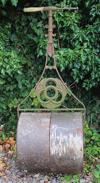 Appraisal: AN OLD CAST AND WROUGHT IRON GARDEN ROLLER with wooden