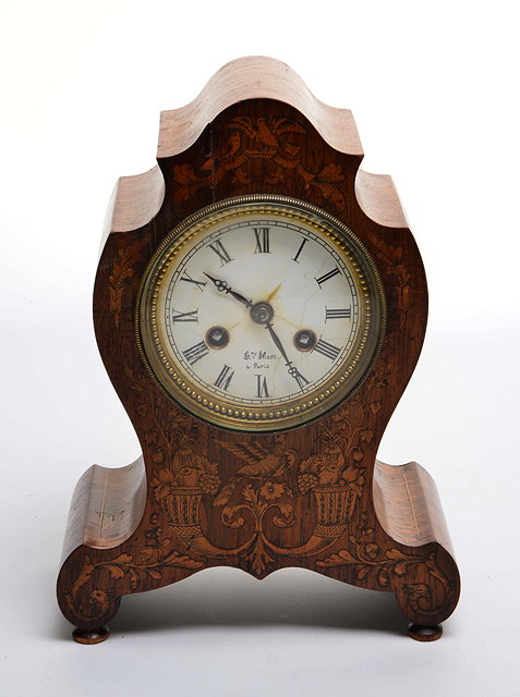 Appraisal: A TH CENTURY ROSEWOOD MANTLE CLOCK the shaped case decorated