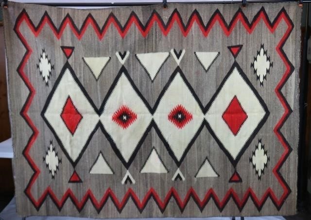 Appraisal: EARLY TH C NAVAJO RUG WITH GEOMETRIC DIAMONDDESIGN CHEVRON BORDER