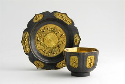 Appraisal: A small Chinese bronze and parcel-gilt hexagonal cup and saucer