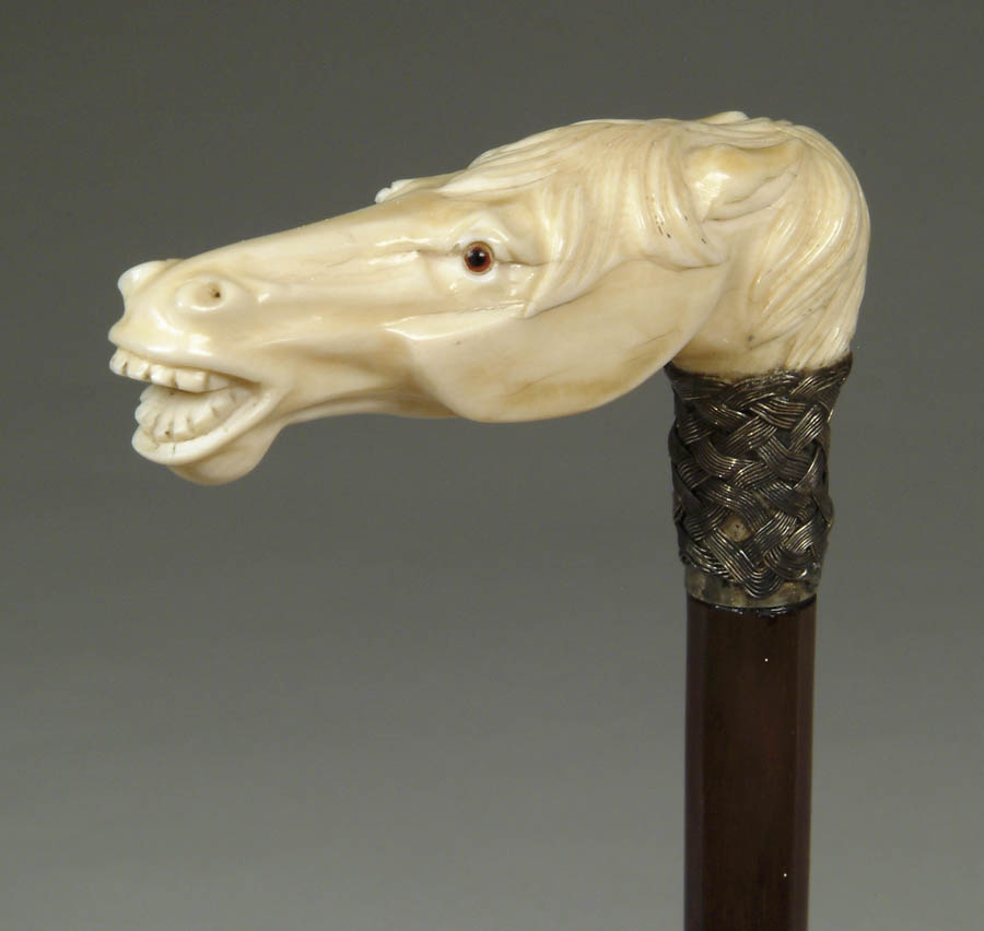 Appraisal: CARVED IVORY HORSE HEAD CANE Long horse head has open