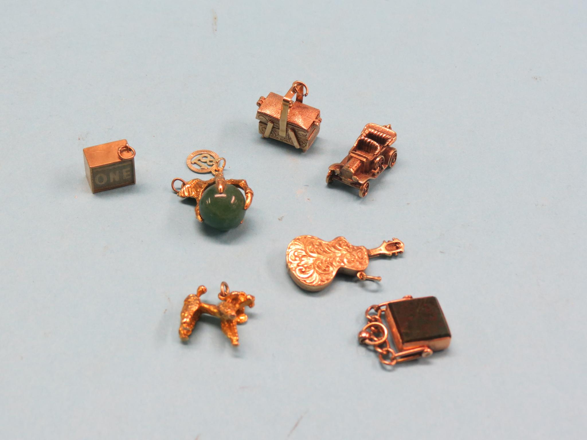 Appraisal: Eight various gold charms gold yellow metal charms including five