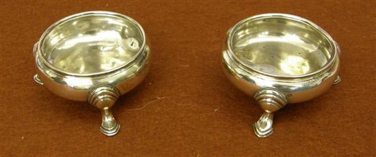 Appraisal: Pair of George III round silver salts raised on three