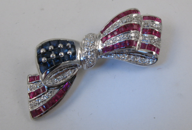 Appraisal: RUBY AND SAPPHIRE BROOCH The k white gold American flag